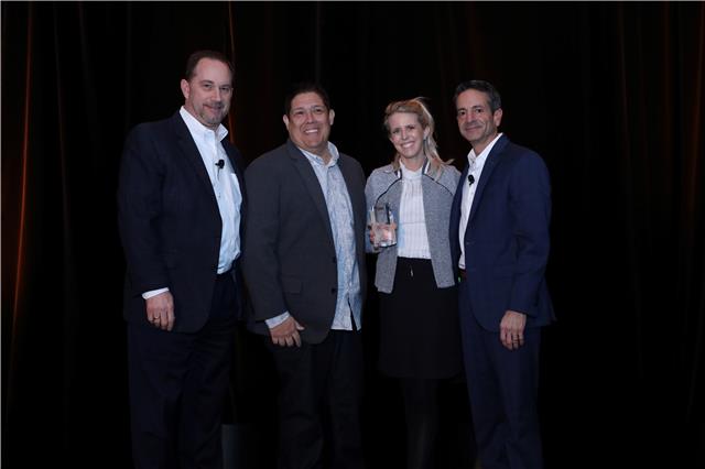 GMSS team smiling and holding an award